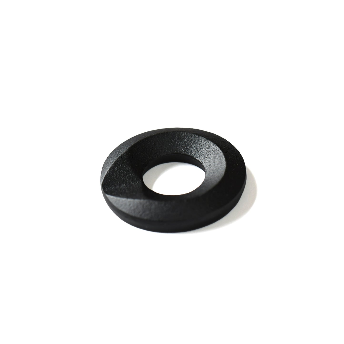 Black cast iron chopstick rest with circular sculptural form by Yamagata artisan