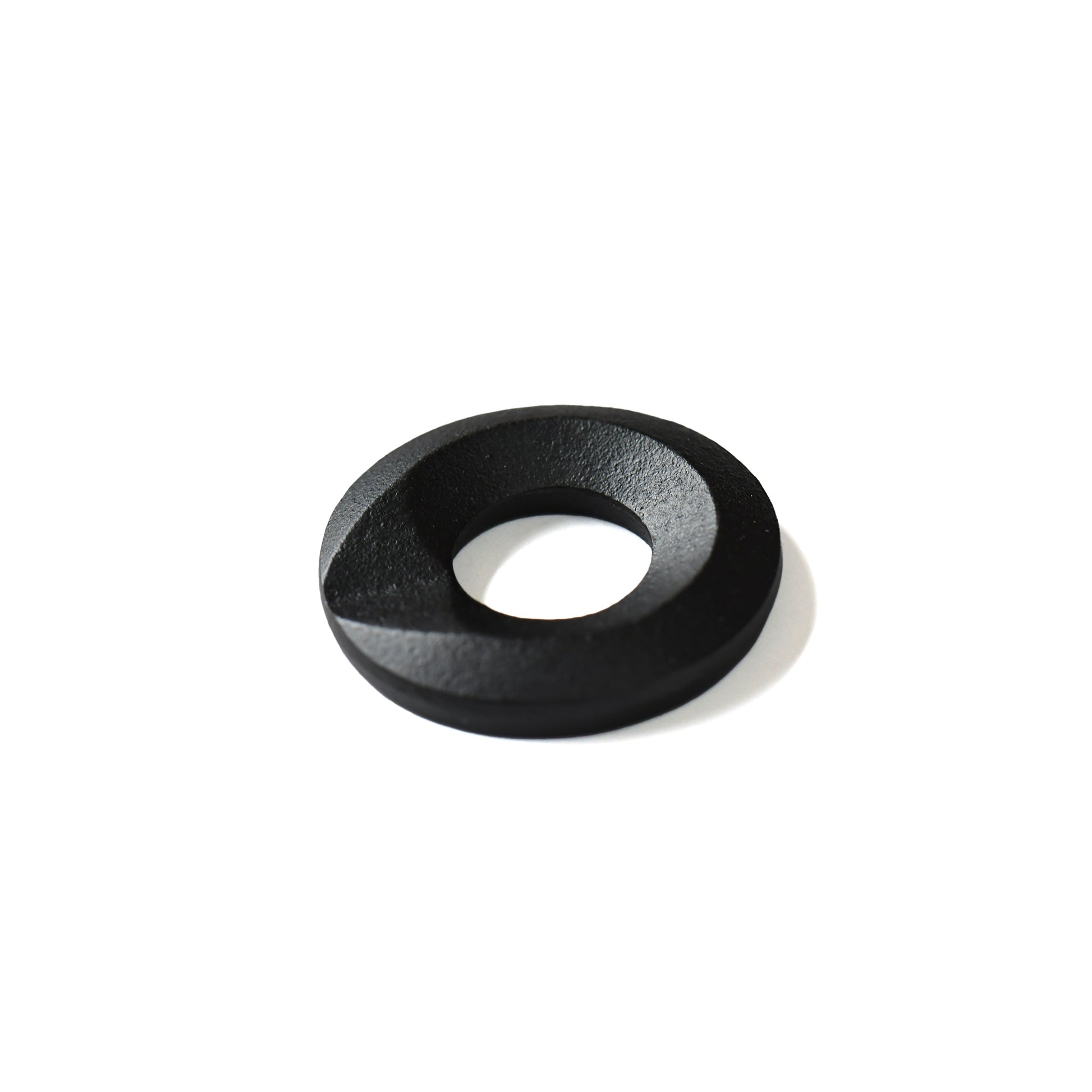 Black cast iron chopstick rest with circular sculptural form by Yamagata artisan
