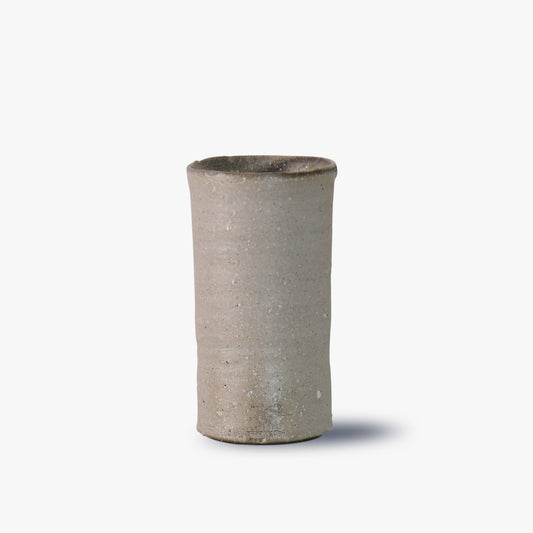 Cylindrical ceramic vase on a white background