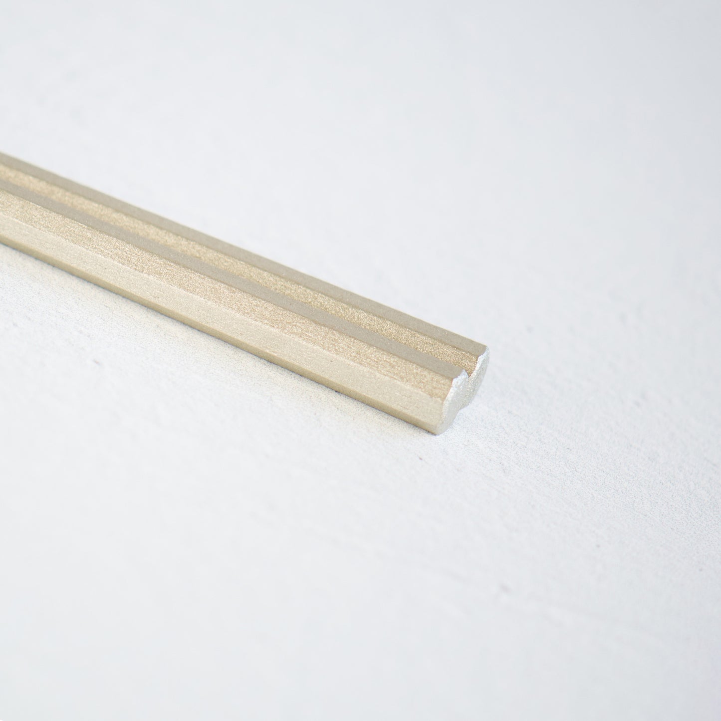 A close-up view of the beautifully coated lacquer heads of a pair of chopsticks. Made in Japan. Japanese tableware. 