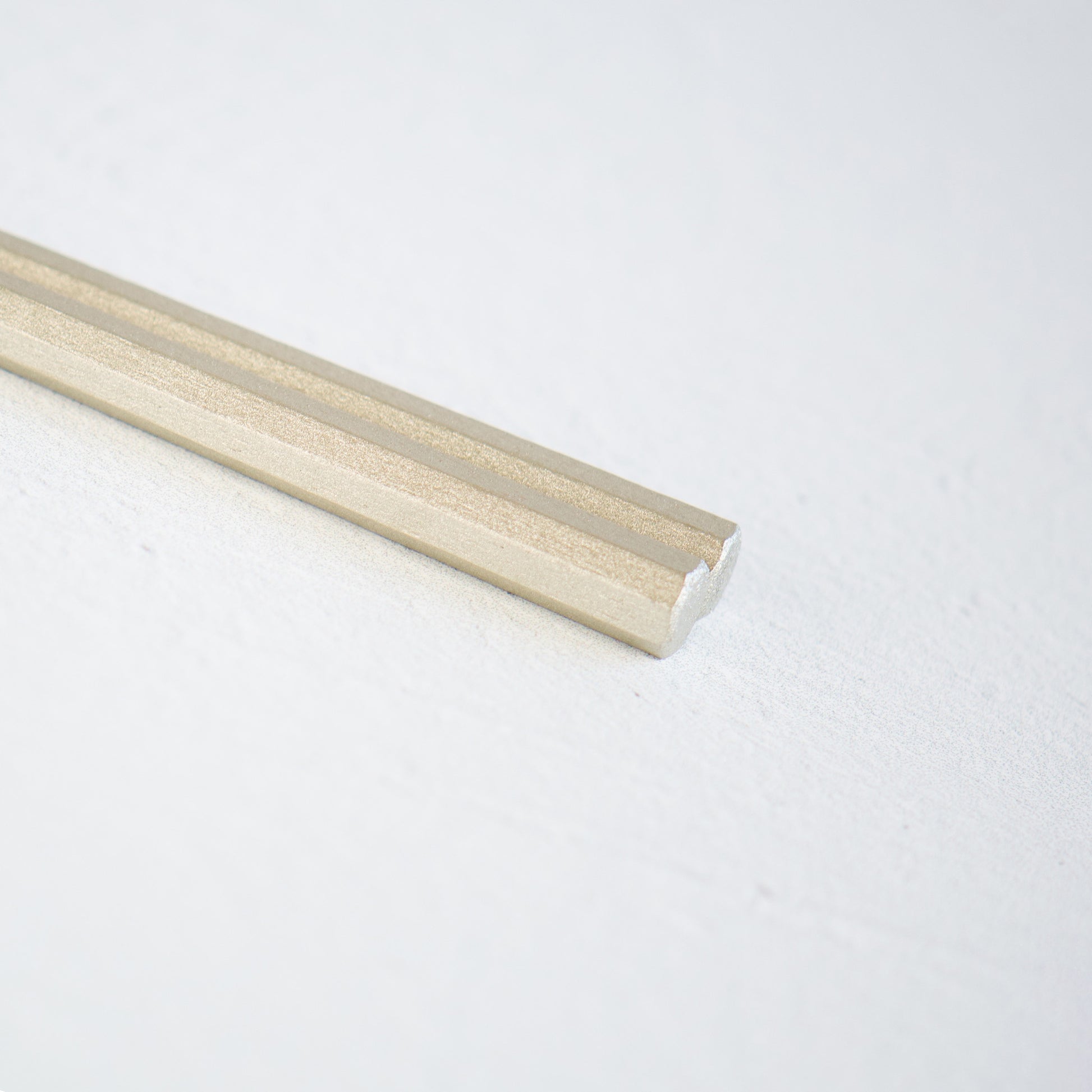 A close-up view of the beautifully coated lacquer heads of a pair of chopsticks. Made in Japan. Japanese tableware. 