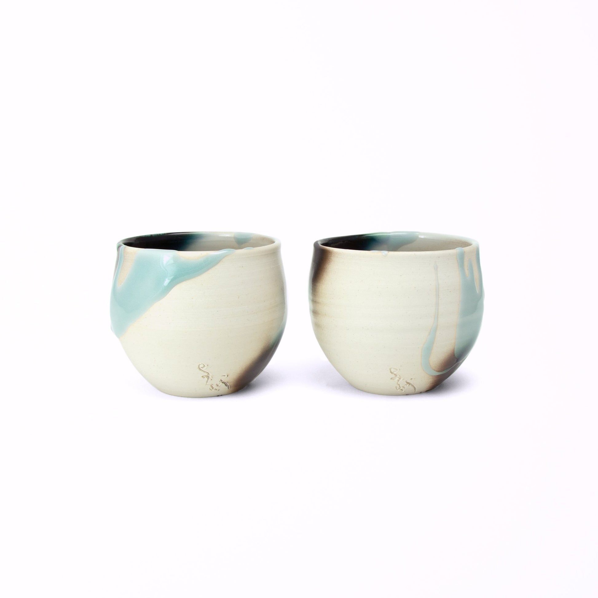 Two cup Japan tea set Kage-Ao Takenishi’s etched signature on the lower side near the base. The blue glaze looks like dripping and Takenishi made it possible with lots of trials and errors.