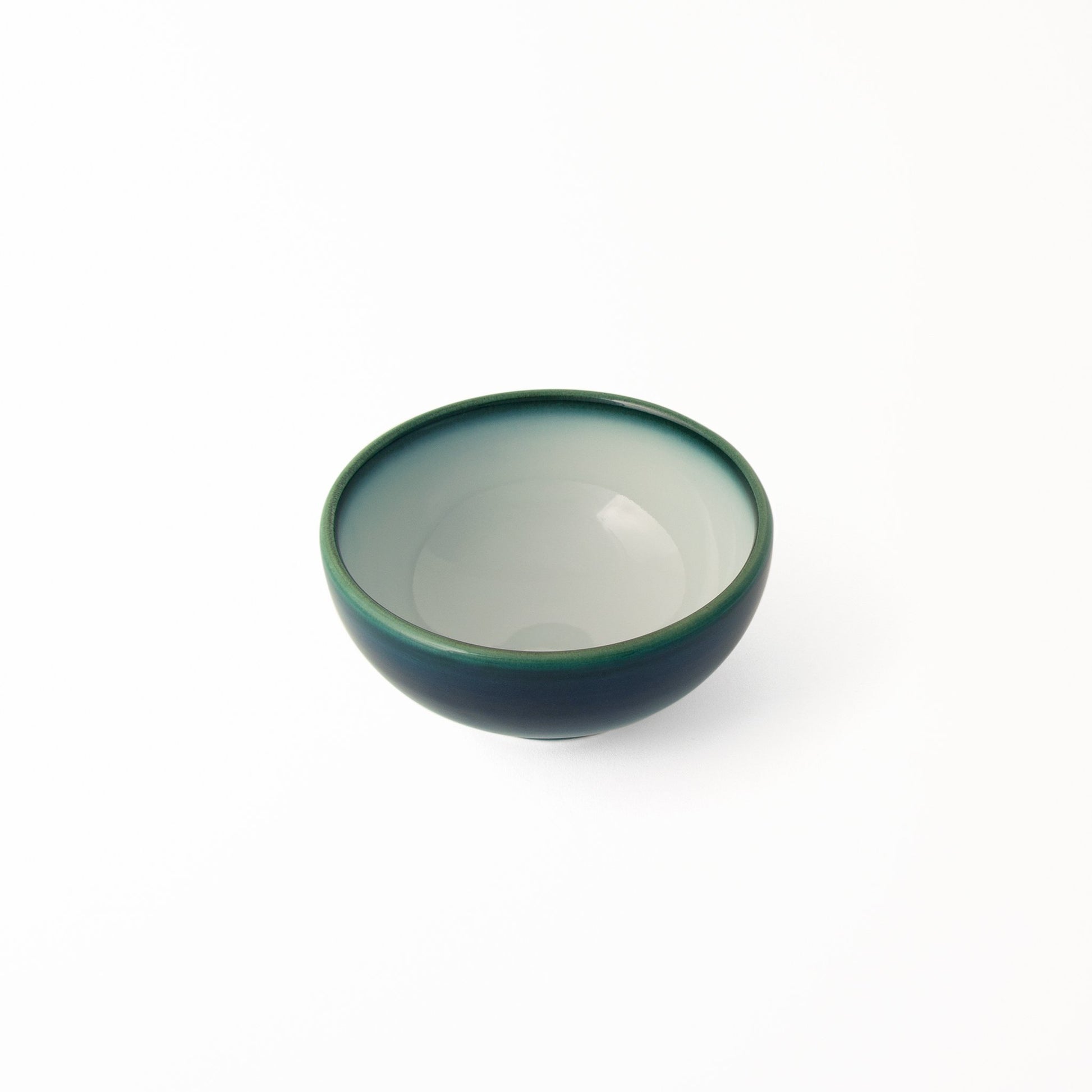 Ceramic bowl artisan-made in Japan Shima White glossy white glaze inside bordered with deep blue glaze hint of green at rim