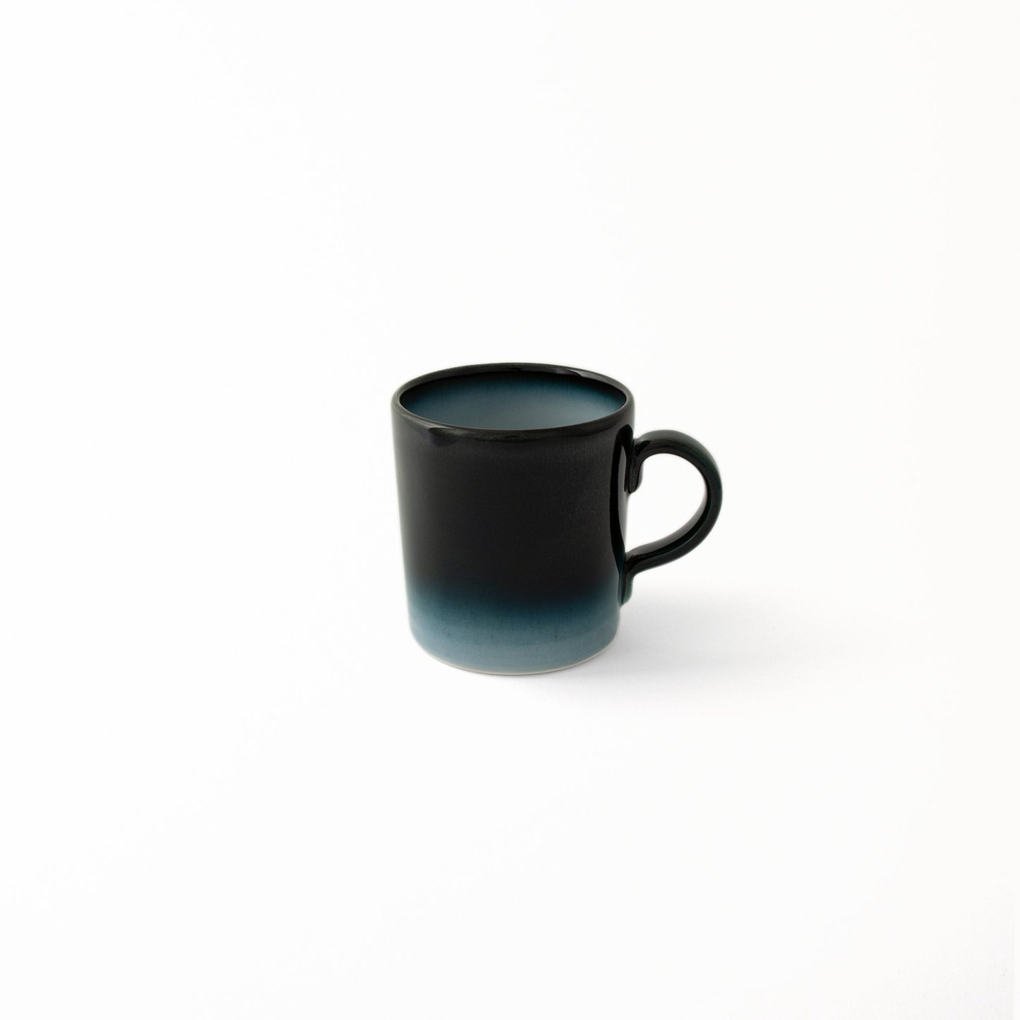 Modern Japanese ceramic Seto Blue mug deep blue glaze diffusing to lighter shades of blue at base